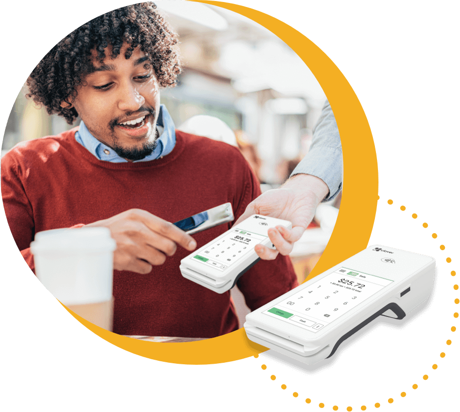 Customer using processing terminal to pay with credit card.